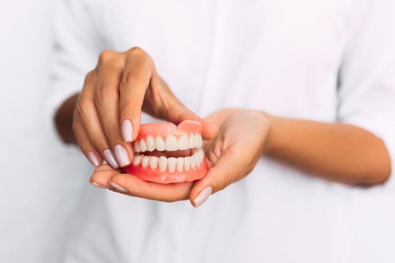 Dentures are removable artificial teeth that can replace missing teeth and help you eat, speak, and smile with confidence.